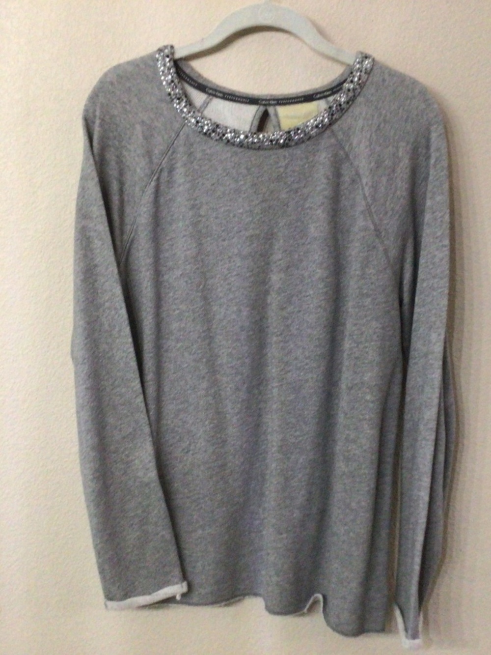 Calvin Klein performance lightweight sweater with bling on collar. Size medium.